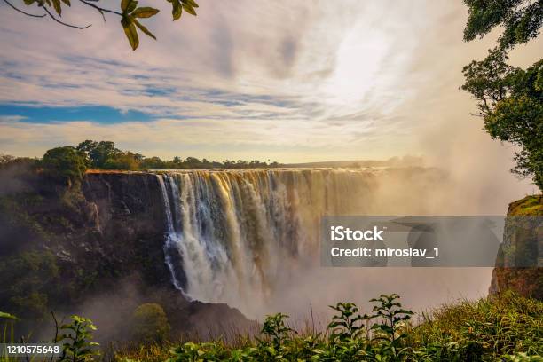 Sunset At The Victoria Falls On Zambezi River In Zimbabwe Stock Photo - Download Image Now