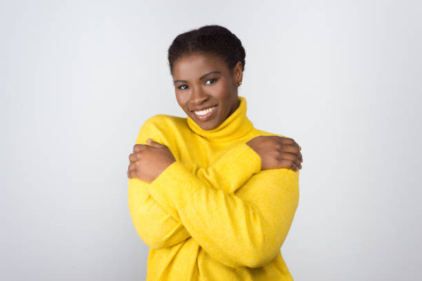 istock Cheerful young woman smiling at camera 1210575915