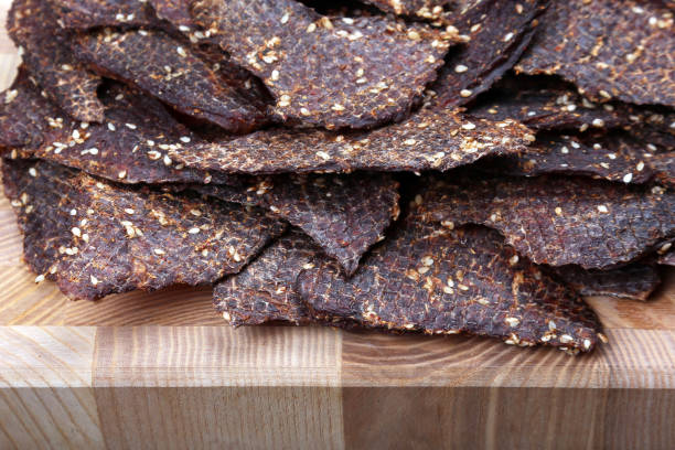 istock dried beef slices in spices with sesame seeds 1210576048