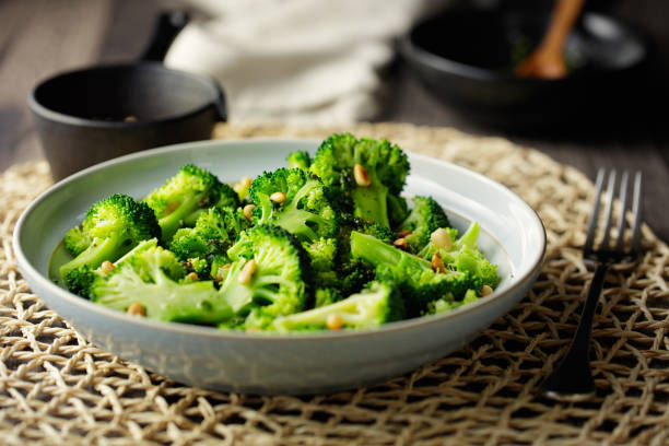 home made poached broccoli with roasted pine nuts,coconut oil based vinaigrette dressing