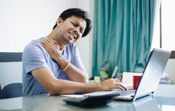 istock Office syndrome ,Young Asian office worker Suffering From Neck Pain From using a notebook computer 1210578702