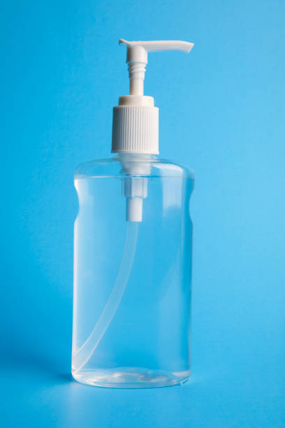 istock Bottle of Hand Sanitizer on Blue 1210580280