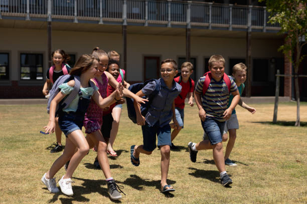 istock School children running in school playground 1210582329