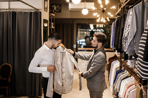 Young Businessman shopping for a new suit.