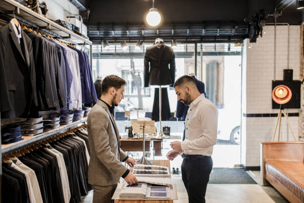istock Man choosing a fabric for a new suit 1210582701