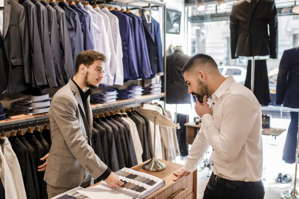 istock Man choosing a fabric for a new suit 1210582758