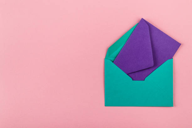 istock Colorful envelopes on a pink background. 1210582902