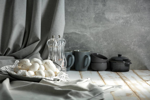 istock Still life with Easter eggs on a wooden table covered with a tablecloth with space for an advertising product. Cozy home interior. 1210583239