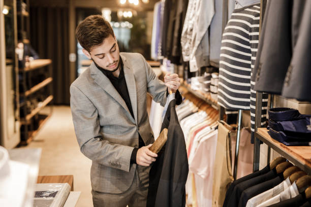 istock Man working in a menswear store 1210583384