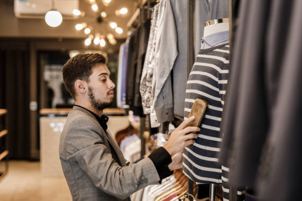 istock Man working in a menswear store 1210584461