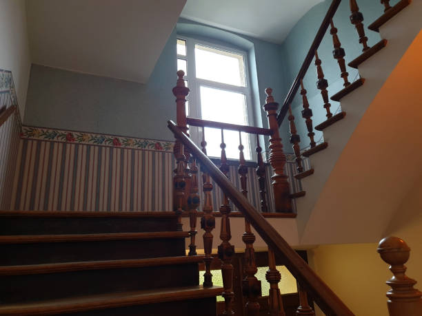 istock Old rustic wooden staircase in a hallway stairwell 1210584715