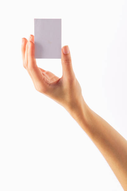 istock Empty paper card in woman hand on white 1210584802