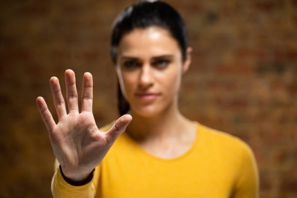 istock Caucasian woman with arm raised and hand 1210584921