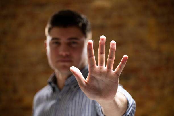 istock Caucasian man with arm raised and hand 1210584941