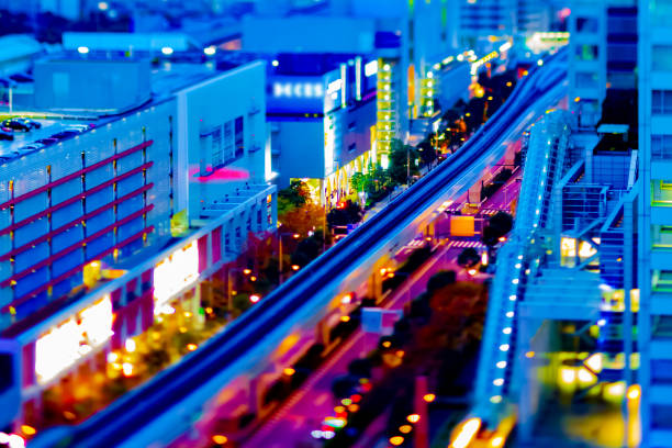 A dusk of the train on the city railway in Tokyo high angle tiltshift A dusk of the train on the city railway in Tokyo high angle tiltshift. Koutou district Daiba Tokyo Japan - 12.07.2020 : It is a center of the city in tokyo. diorama photos stock pictures, royalty-free photos & images