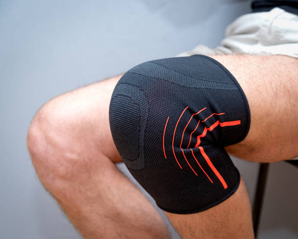istock elastic bandage on an injured knee 1210587789