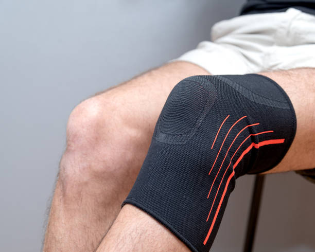 istock elastic bandage on an injured knee 1210587926