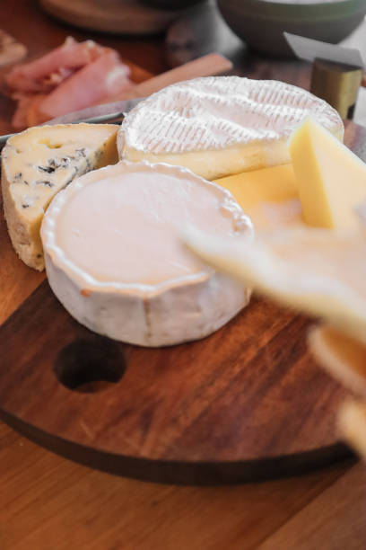 selection of cheese on wooden cheese board