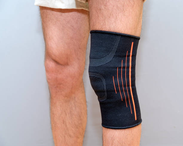 istock elastic bandage on an injured knee 1210588317