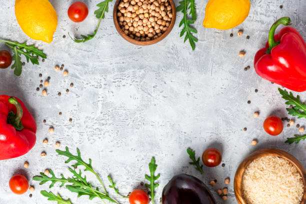 istock Vegetables, lemon and chickpeas on a concrete background, top view, free space for text. 1210588320