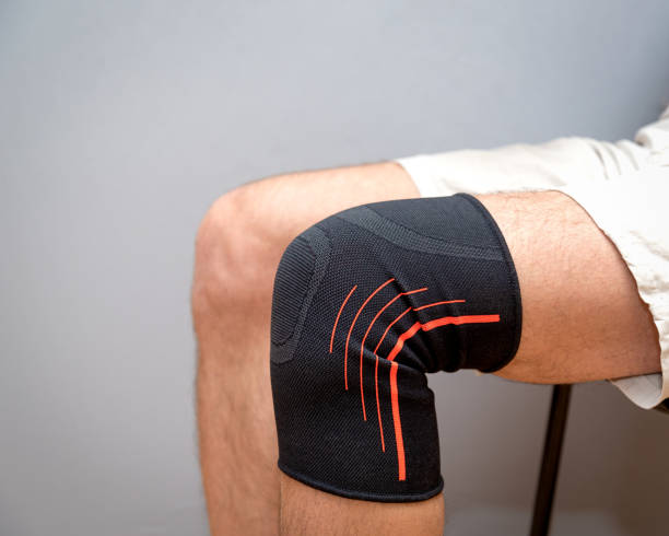 istock elastic bandage on an injured knee 1210588326
