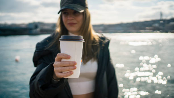 istock Women drink take way coffee 1210590757
