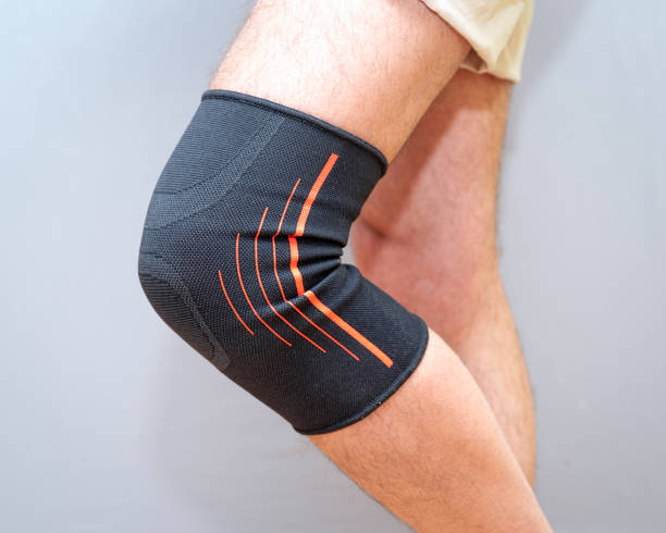 istock elastic bandage on an injured knee 1210590909