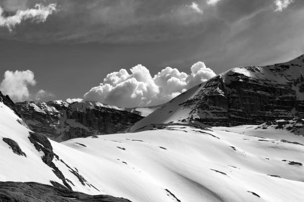 istock Snowy rocks and cloudy sky at evening mountains 1210591542