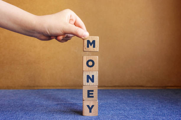 istock MONEY word made with building blocks. 1210591576