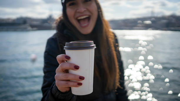 istock Women drink take way coffee 1210592480