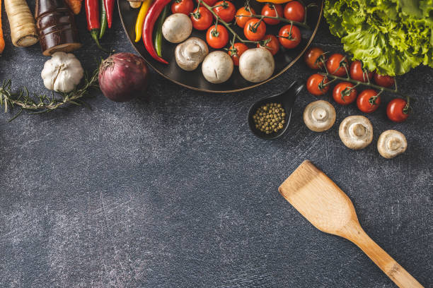 istock One wooden spoon and vegetables 1210592581