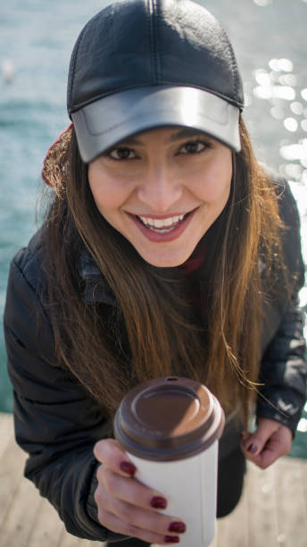 istock Women drink take way coffee 1210592601