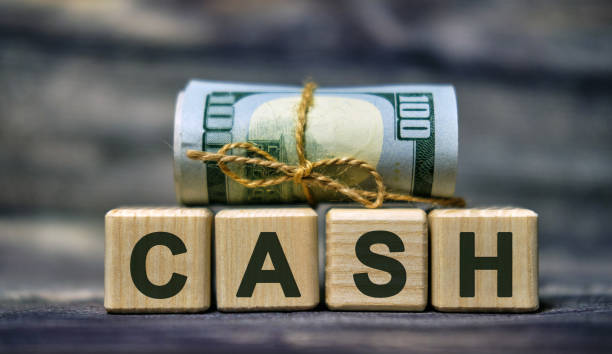 istock CASH word concept on cubes with a Banknote 1210594789