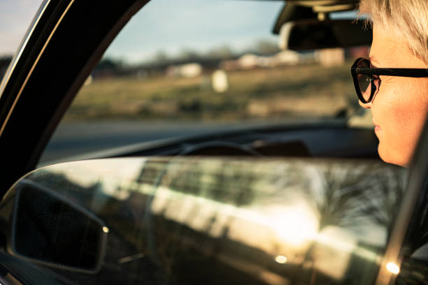 istock Smiling woman in a car 1210598501
