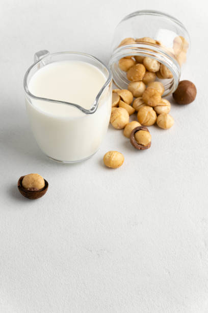 istock Dairy-free milk. Macadamia nut milk on a light background. 1210598976