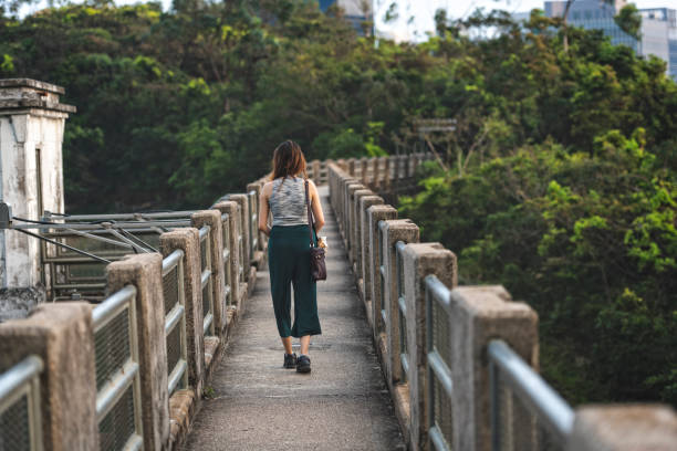 istock Young woman in the narrow passage 1210599158