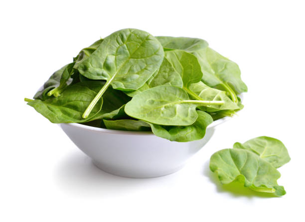 istock Fresh bunch of spinach in the bowl. 1210600633