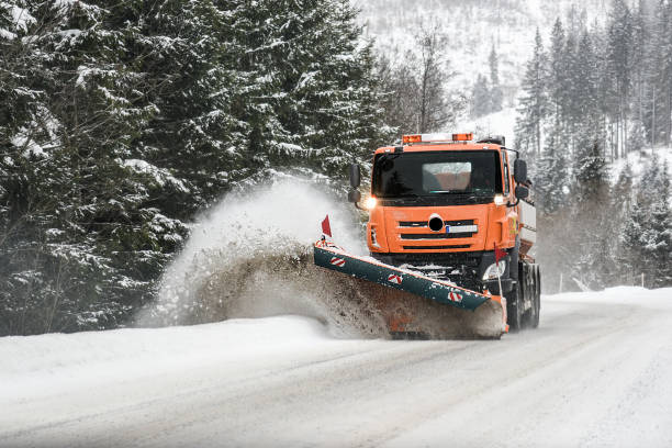 istock Snow plow truck on snowy road. 1210601279