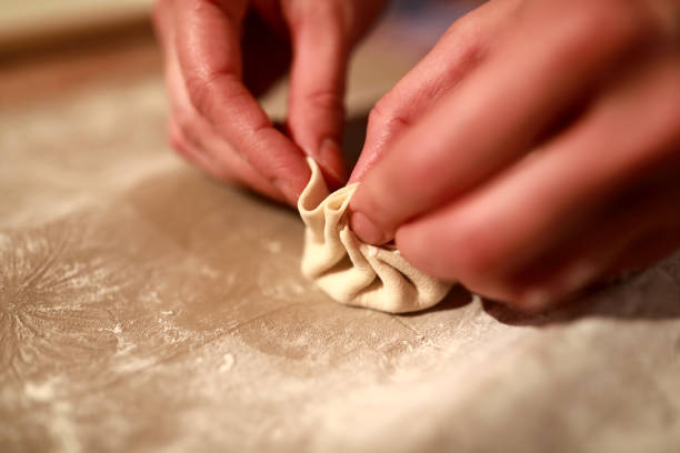 istock Person cooking khinkali 1210601284