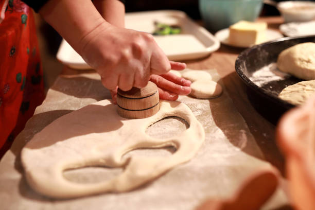 istock Woman preparing dough for making khinkali 1210601299