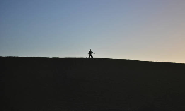 istock a man doing Tai Chi at dawn on the desert dunes 1210603211