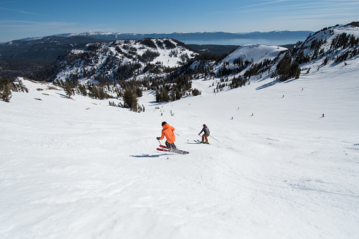 Skiers play and rip lines in Truckee, California mountains
