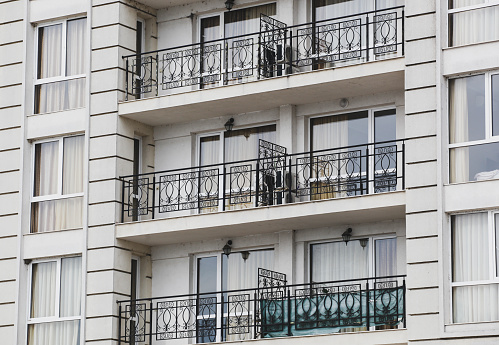 Many hotel balcony with glass door. Apartment balcony with glass window.