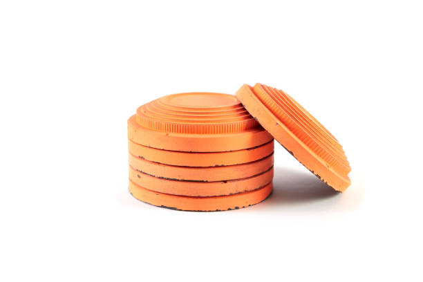 istock Orange cymbals for trap shooting on white background 1210614483