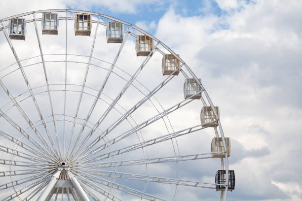istock Ferris wheel on background of cloudy sky 1210614737