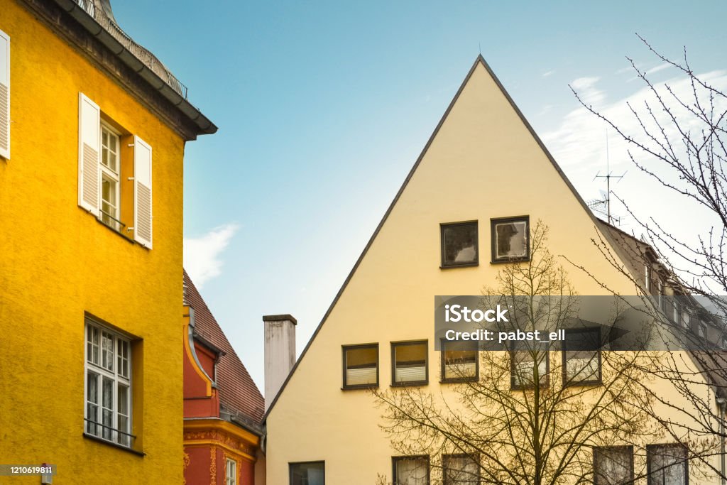 Ingolstadt townhouses looking up to blue sky golden hour Old townhouses in historic district in Ingolstadt, Germany. Blue sky on the background. Architecture Stock Photo