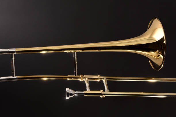 istock Golden trombone close-up with dark background 1210620738