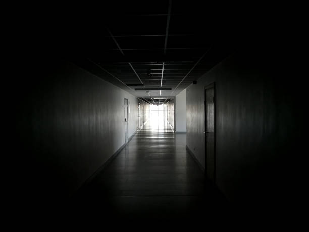 istock Bright light at the end of the dark spooky coridor 1210621629