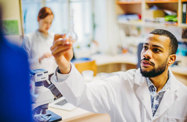istock Scientist looking at the reagent 1210625214