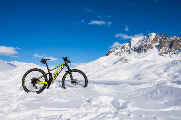 istock Mountain biking in the snow in the high mountains 1210626877